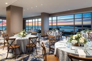 a banquet room with tables and chairs with a view at The Westin Tampa Bay in Tampa