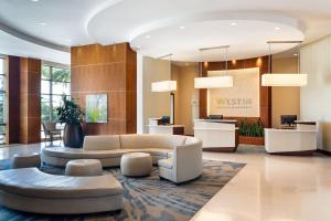 a lobby of a hotel with a couch and chairs at The Westin Tampa Bay in Tampa