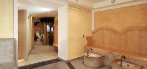 a bathroom with two urinals in a room at Pension Wendlhof in Obergurgl