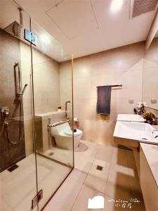 a bathroom with a toilet and a sink and a shower at Maison life 小居屋 The Loft Imago in Kota Kinabalu +37 photos