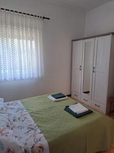 Postel nebo postele na pokoji v ubytování Apartments Berny