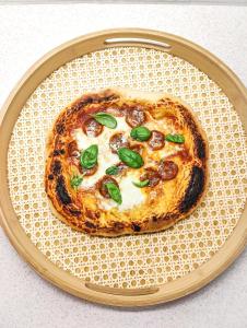 a small pizza on a plate on a table at Kyrkjestølen B&B in Tyinkrysset