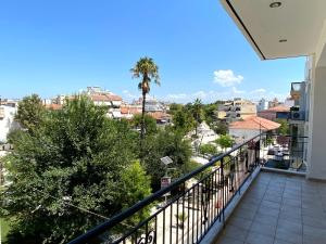 a balcony with a view of a city at Sunny Apartment Amaliada in Amaliás