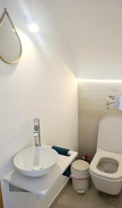 a bathroom with a sink and a toilet at Casa-Mar Nerja in Nerja