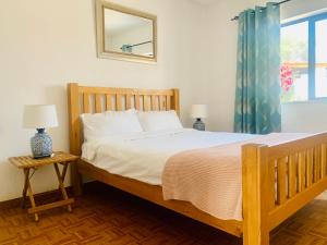 En eller flere senge i et værelse på Quinta da Bela Vista
