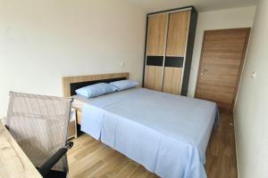 a small bedroom with a bed and a closet at 1bd Sea View Apts Veliki Pjesak "Mula" in Dobra Voda