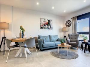 a living room with a couch and a table at Levansur Apartment - 9109 in San Pedro del Pinatar