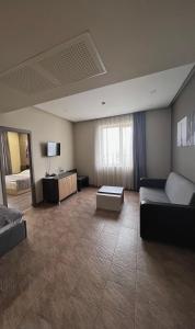 TV a/nebo společenská místnost v ubytování Bien hotel