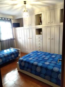 A bed or beds in a room at VILLA MOLINELLA