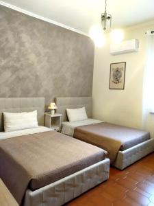 A bed or beds in a room at VILLA MOLINELLA