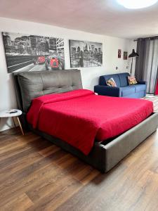 En eller flere senge i et værelse på Vacabruz Apartment