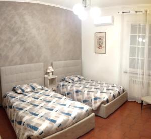 A bed or beds in a room at VILLA MOLINELLA