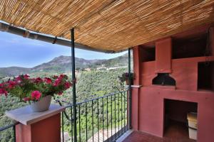 a balcony with a view of the mountains at Mamaamelia in Levanto