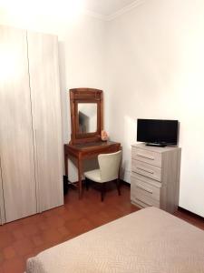 A television and/or entertainment centre at VILLA MOLINELLA