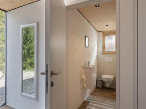 a bathroom with a toilet and a window at Ferienwohnung Auszeit am See in Achensee