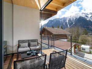 a balcony with a view of a mountain at Ferienwohnung Auszeit am See in Achensee