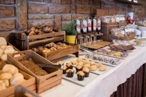 a buffet of bread and pastries on a table at Hotel Bellavista in San Zeno di Montagna