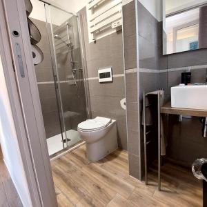 a bathroom with a toilet and a shower and a sink at B & B Eliana in Florence +84 photos