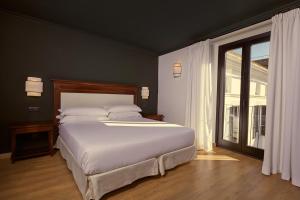 Postel nebo postele na pokoji v ubytování Hotel Born