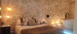 Giường trong phòng chung tại Gaia Resort - El rincón del amor