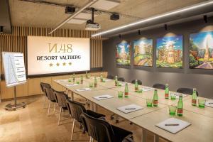 a meeting room with a long table and chairs at Resort Valtberg Valtice in Valtice