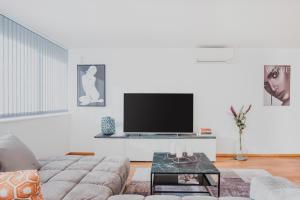 TV a/nebo společenská místnost v ubytování Cocoon am Schloß
