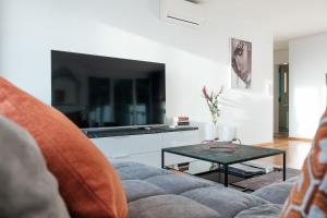 TV a/nebo společenská místnost v ubytování Cocoon am Schloß