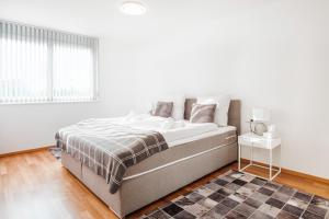 Postel nebo postele na pokoji v ubytování Cocoon am Schloß