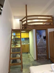 a bedroom with a bunk bed with a ladder at Pinelopi’s House in Porto Koufo +47 photos