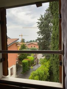 a view of a street from a window at Lory apartment in Bardolino