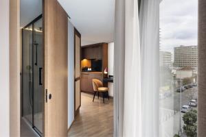 a room with a view of a kitchen and a living room at Four Points by Sheraton Matosinhos in Matosinhos