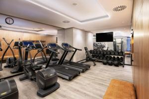 a gym with treadmills and cardio equipment in a room at Four Points by Sheraton Matosinhos in Matosinhos