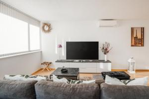 TV a/nebo společenská místnost v ubytování Cocoon am Schloß