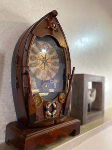 a wooden clock sitting on top of a shelf at Bab al-sham funduk in ‘Akko