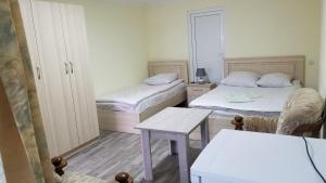 Postel nebo postele na pokoji v ubytování Guest House Green Rose
