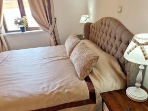 Кровать или кровати в номере SOFIA BOUTIQUE HOTEL