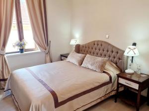 Кровать или кровати в номере SOFIA BOUTIQUE HOTEL