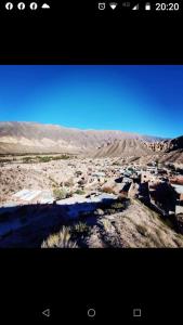 a view of a town in the middle of the desert at La calandria in Tilcara