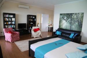 Tempat tidur dalam kamar di La Vue