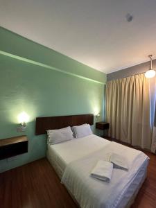 Postel nebo postele na pokoji v ubytování De Choice Hotel Tawau + 37 fotografií