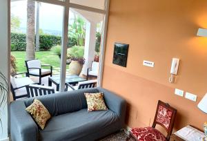 A seating area at Temenos Villa by Ortigiaapartments