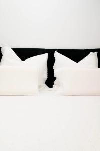 two white pillows on top of a bed at Dreambed 1 in Baia Mare