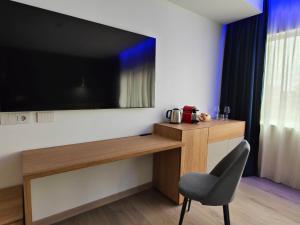 TV a/nebo společenská místnost v ubytování Carducci Art Guesthouse