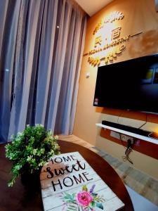 a room with a table with a sign that says home away from home at Stylish Micasa 4 Home 3BR+FREE PARKING -Hann's Residence in Sibu