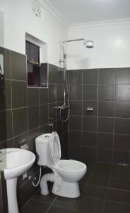 Vonios kambarys apgyvendinimo įstaigoje Koselig Homes