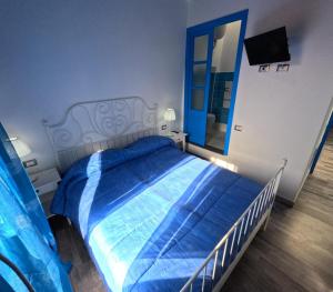 מיטה או מיטות בחדר ב-Sole Azzurro Suite