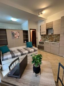 a living room with a couch and a laptop on a table at Siena Fox In in Siena +27 photos