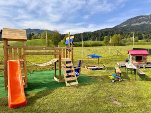 a group of playground equipment in a field at Apartments Katarina in Fieberbrunn
