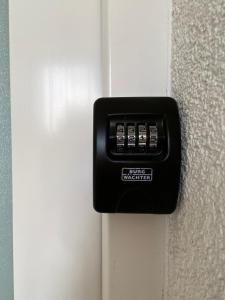 a black door lock on a white door at Apartman Lucija in Gradići