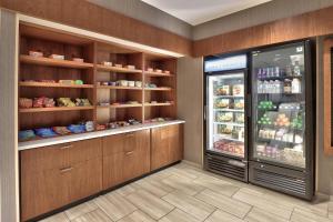 a store room with a refrigerator with food in it at SpringHill Suites Durango in Durango